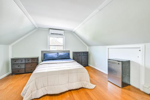 a bedroom with a large bed and a window at Long Island Duplex By Airport and Train in Valley Stream