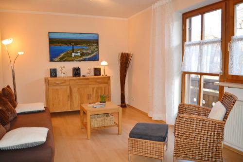 a living room with a couch and a table at Chiemseenest in Prien am Chiemsee