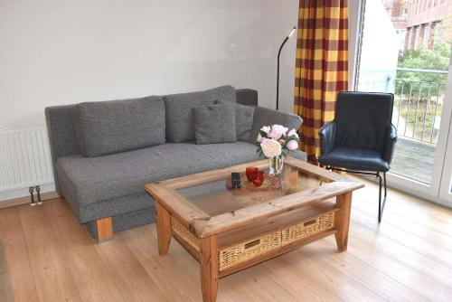 a living room with a couch and a coffee table at Seepassage Ferienwohnung Nr 02 in Timmendorfer Strand