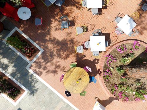 an overhead view of a table and flowers on a patio at A for Art Hotel in Limenas