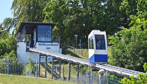 a white and blue train on a track at Appartementhaus mit Meerblick im Ostseebad Göhren HO in Göhren