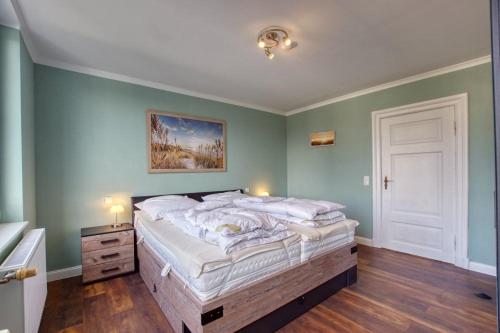 Ένα ή περισσότερα κρεβάτια σε δωμάτιο στο Haus Mühlenstraße 8, App 7MSOG2