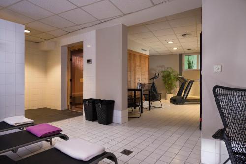 a waiting room with two chairs and a table at Wyndham Garden Potsdam in Potsdam
