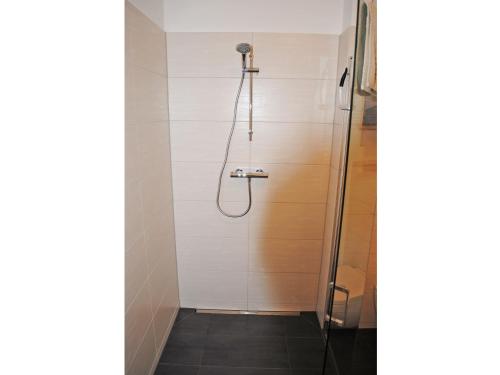 a shower with a glass door in a bathroom at Ferienwohnung in der Altstadt in Bad Bevensen