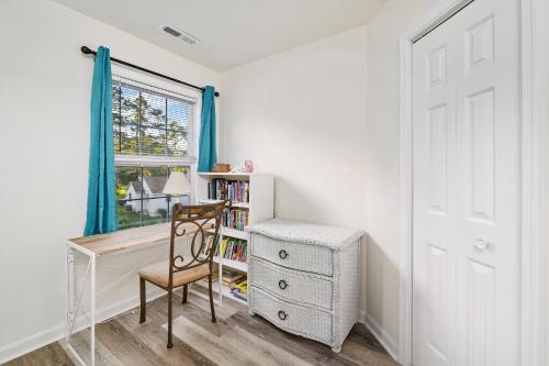 a room with a desk and a chair and a window at Lighthouse Overlook in Birch Town