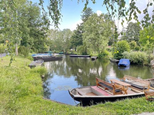 a group of boats parked on a river at Ferienwohnung Altstadtidyll in Lübbenau