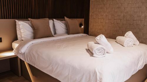 Ein Bett oder Betten in einem Zimmer der Unterkunft R Lapsi Guesthouse