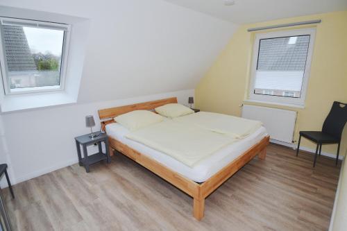 Voodi või voodid majutusasutuse Möwenstrasse oben toas