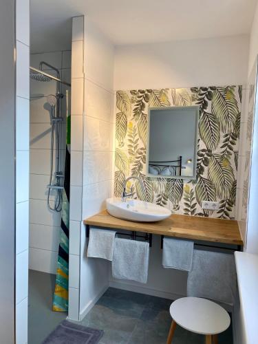 a bathroom with a sink and a mirror at Pastelani in Buckow