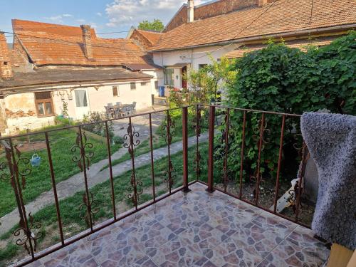 a balcony with a iron fence and a yard at Gruia Ele Apartament in Cluj-Napoca