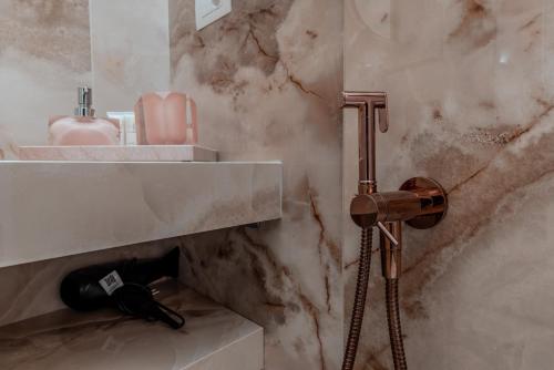 a shower in a bathroom with a sink at Princes Apartment PortoCervoBEACH con accesso diretto in spiaggia Piccolo Pevero in Porto Cervo