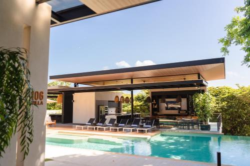 an image of a house with a swimming pool at Epic Tamarindo Boutique Hotel in Tamarindo
