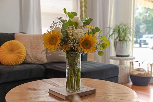 a vase of flowers sitting on a table at Midtown Bungalow in Reno