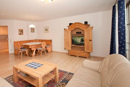 a living room with a couch and a table at Ferienwohnung Birkenstraße Nesselwang 9 in Nesselwang