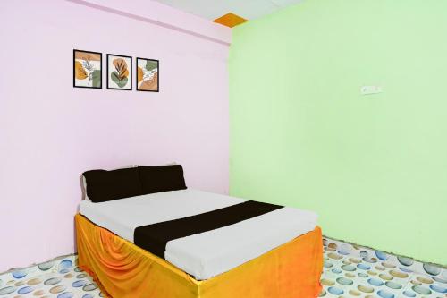 Katil atau katil-katil dalam bilik di SPOT ON Parihar Hotel