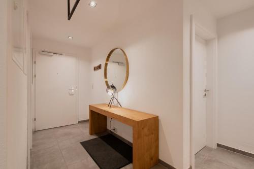 a mirror sitting on a table in a room at HEAVEN 7 SUITE - Garden Apartment with Private Whirlpool in Zillertal, presented by AlpenLuxus in Fügen