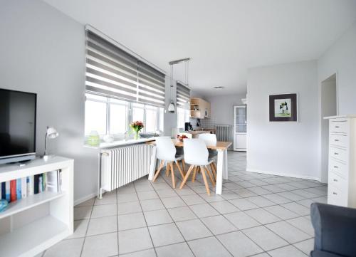 Η κουζίνα ή μικρή κουζίνα στο Haus Windhuug Wohnung 2
