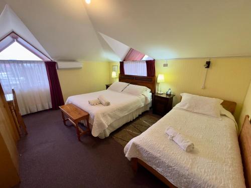 Cama ou camas em um quarto em Hotel Küyen-Ko Pucón
