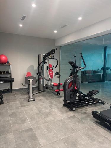a gym with several exercise bikes in a room at Villa Essencia in Zahara de los Atunes