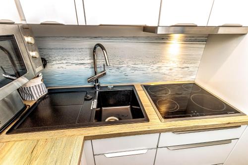 Η κουζίνα ή μικρή κουζίνα στο Ferienhaus Seen-Sucht