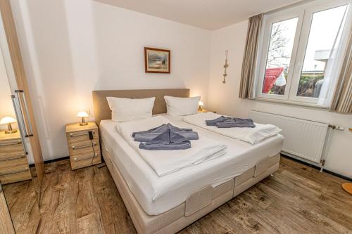 Ένα ή περισσότερα κρεβάτια σε δωμάτιο στο Ferienhaus Seen-Sucht