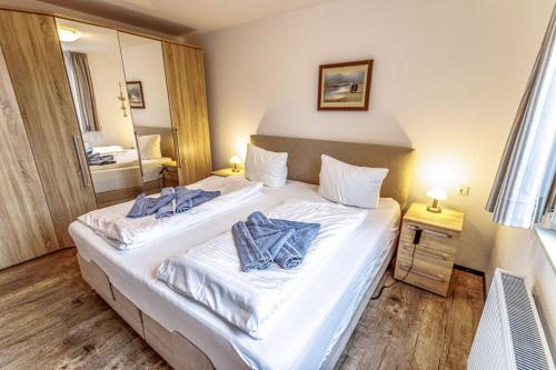 Ένα ή περισσότερα κρεβάτια σε δωμάτιο στο Ferienhaus Seen-Sucht