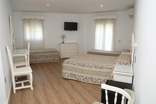 Ein Bett oder Betten in einem Zimmer der Unterkunft La Janda