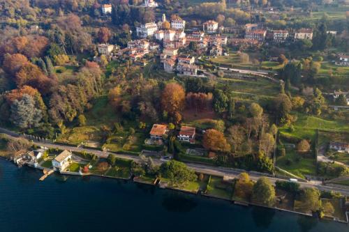 an aerial view of a house on a hill by the water at Casa Luzi Appartamento Vista Lago Orta in Ameno