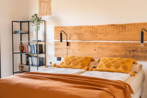 a bedroom with a large bed with two pillows at Casa Murina in Orosei