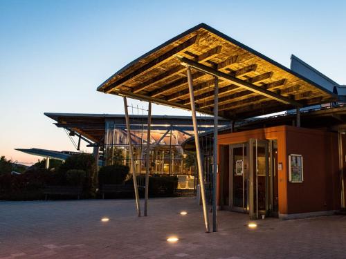 a building with awning in front of a building at Panoramabungalow Typ 70 in Truppach