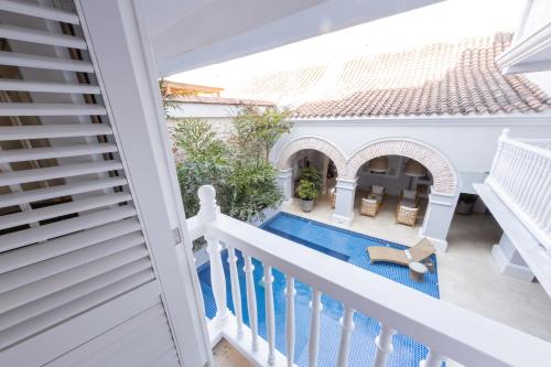 a view from the balcony of a house with a swimming pool at Casa La Merced by Mustique in Cartagena de Indias
