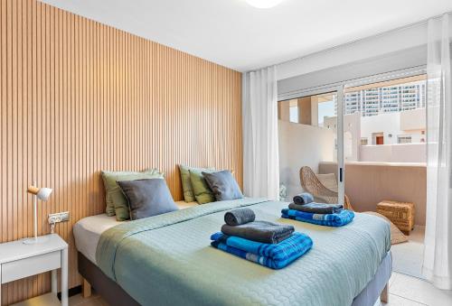 Giường trong phòng chung tại Family Deluxe Apartment