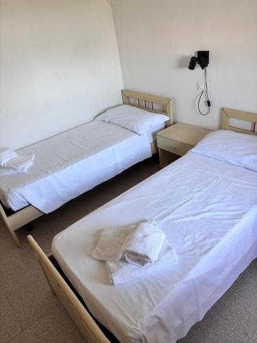 Una cama o camas en una habitación de Platano