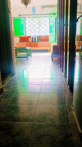 a room with benches and tables in a building at Riad SULTANA lateral seaview in Saidia 