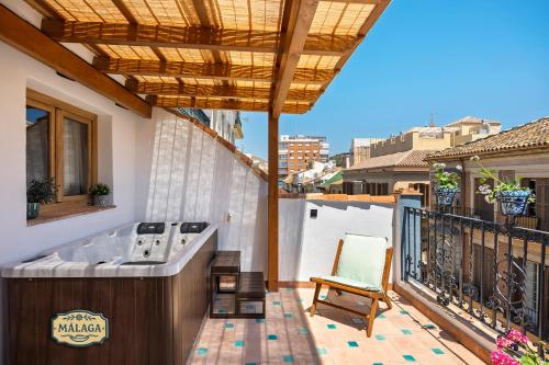 a hot tub on the balcony of a house at Mi Andalusia Hotel Experience in Málaga
