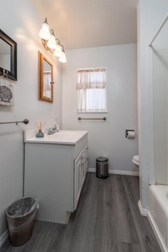 a white bathroom with a sink and a toilet at Lucky Ewe - Ocean View Retreat in Gualala