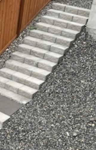 a set of concrete stairs next to a building at Entire Basement in Puyallup, WA in Puyallup
