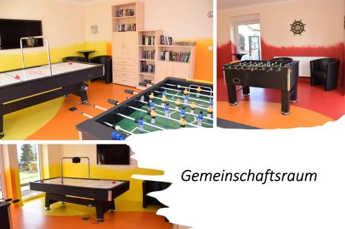 a room with a ping pong table and a ping pong table at Peenemünde, Seglerhafen_ST_Windjammer 4 WE in Peenemünde