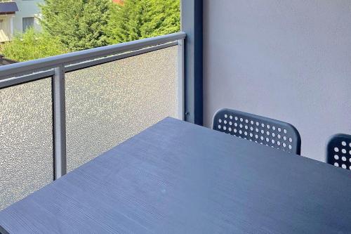 a blue table and chairs on a balcony at Libelle in Lübben