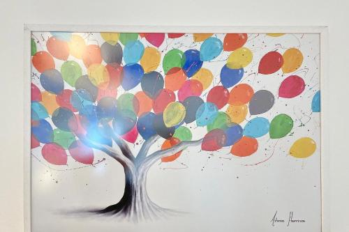 a painting of a tree with balloons at Libelle in Lübben