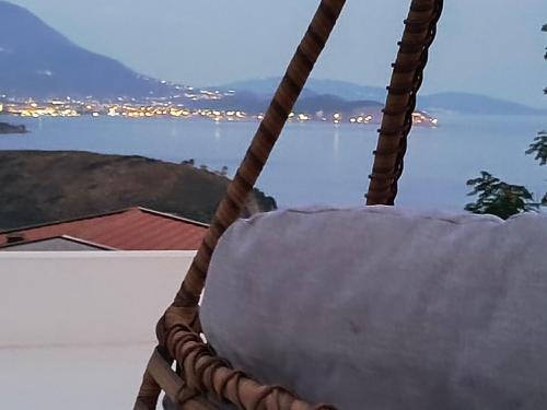 a rope swing with a view of the water at Villa vista mare in Zagrađe