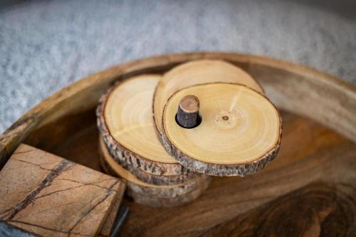 a wooden bowl with a bolt in the middle at Zephyr Cove Zen - Hot Tub & Summer Pool in Zephyr Cove