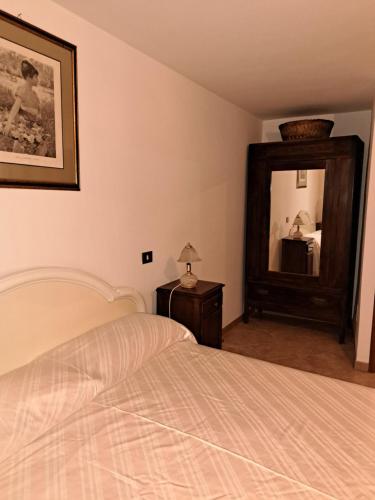 Postel nebo postele na pokoji v ubytování Il Rifugio del Borgo celeste