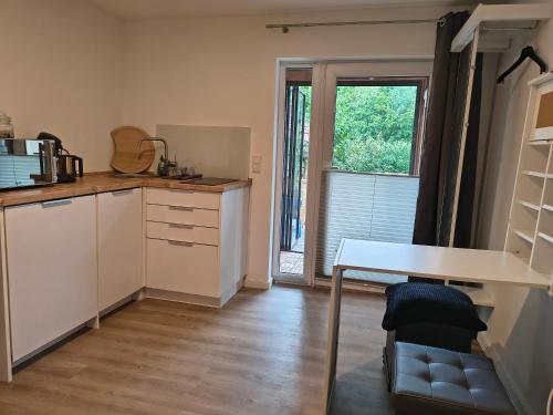 a kitchen with a table and a window at Appartement83 in Schwäbisch Hall