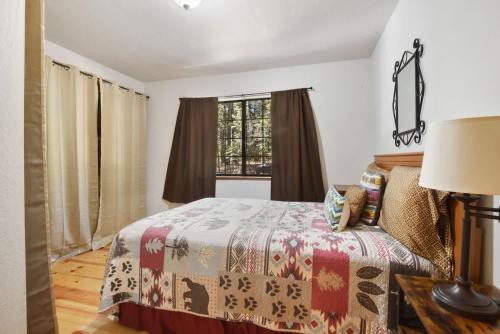 a bedroom with a bed and a window at Elm Street Getaway Sleeps 8 in Tahoma