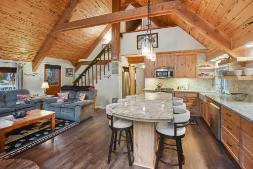 a kitchen and living room with a table and chairs at West Shore Haven - Near Beach & Outdoor Fun in Tahoma
