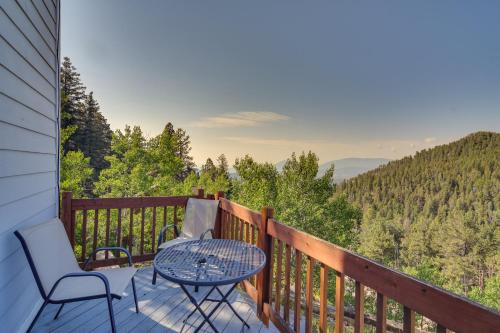 a table and chairs on a deck with a view at Mountain-View Conifer Gem Near Hiking and Fishing in Conifer