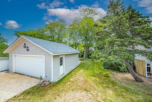a home with a white garage in a yard at Peconic Sound Beach Home: Backyard & Vineyards in Peconic