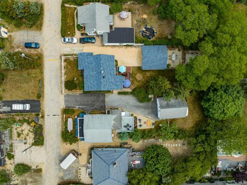 an overhead view of a house with blue roofs at Peconic Sound Beach Home: Backyard & Vineyards in Peconic