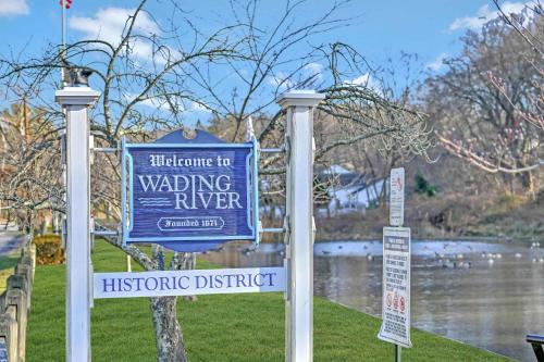 a sign for a wading river in a park at Sea Cliff Charm: 5 Mins to Beach, Firepit in Wading River